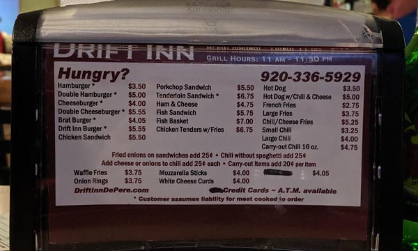 Drift Inn napkin holder containing their menu